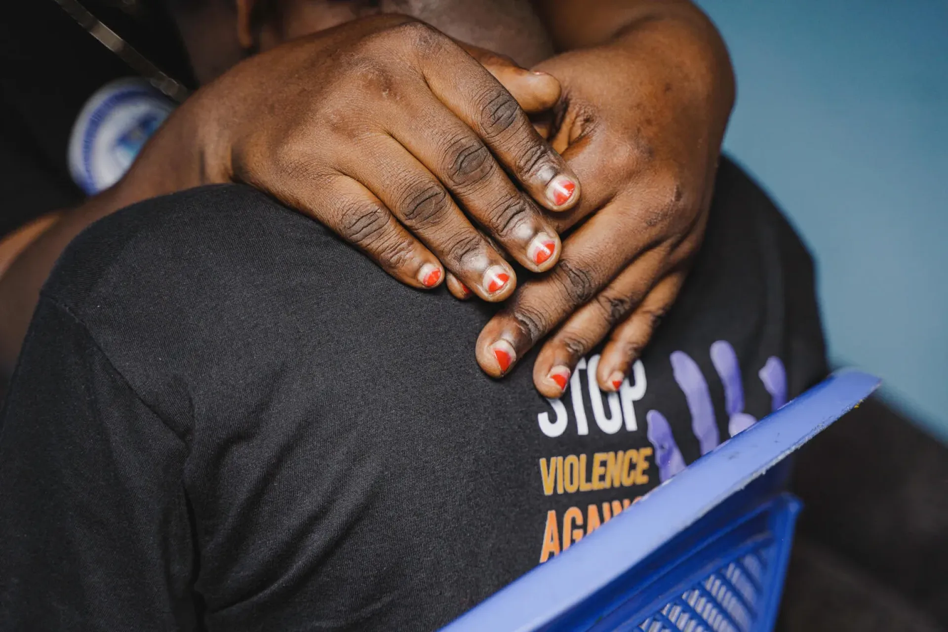 DRC. A woman puts her arms around another woman's shoulders.