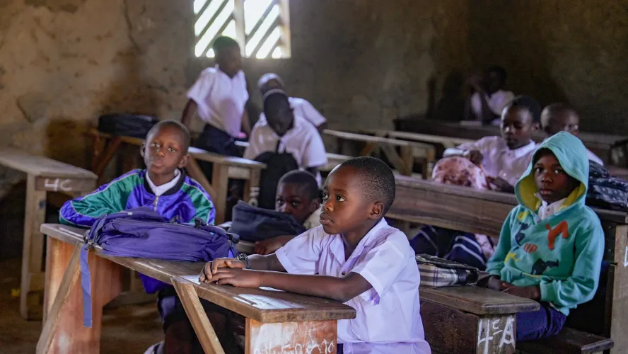 Obed can enjoy his classroom after following Ebola prevention measures.