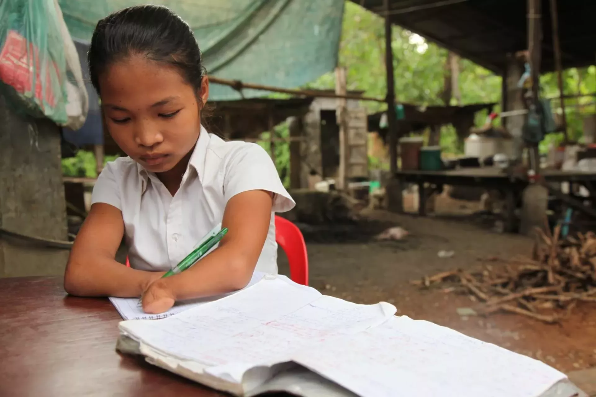 14 year old, Un Kosal, born with shortened forearms and no hands does not let her disability prevent her from aspiring to be a teacher.