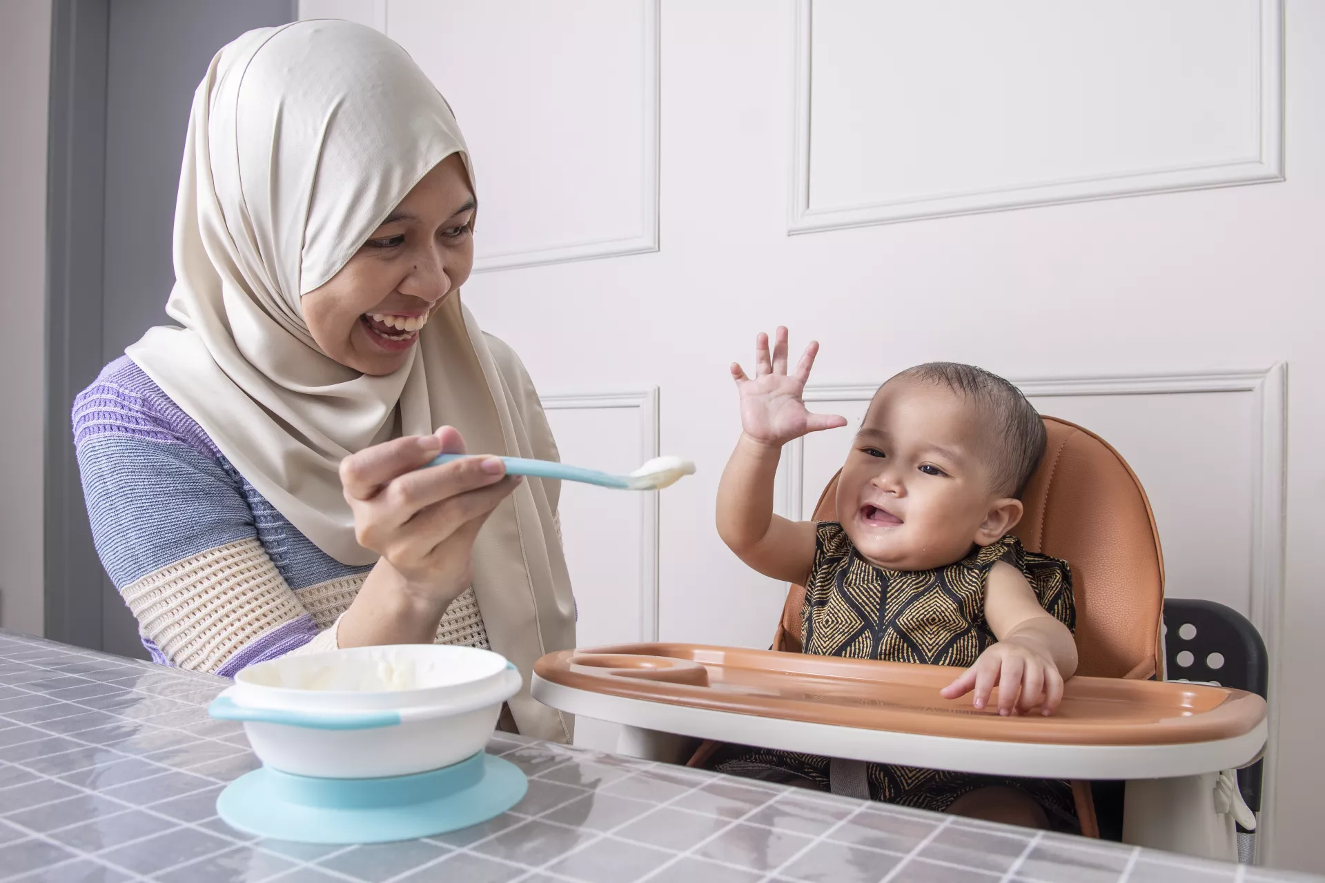 Mother feeding her child
