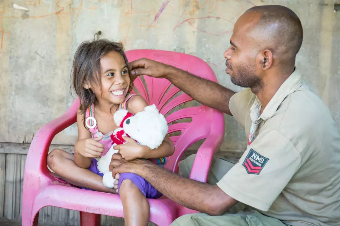 Ester Pereira, 5 years, loves playing with father Simiao Pereira. Ester has borrowed the teddy bears from the school, as she doesn&Otilde;t have any toys of her own.