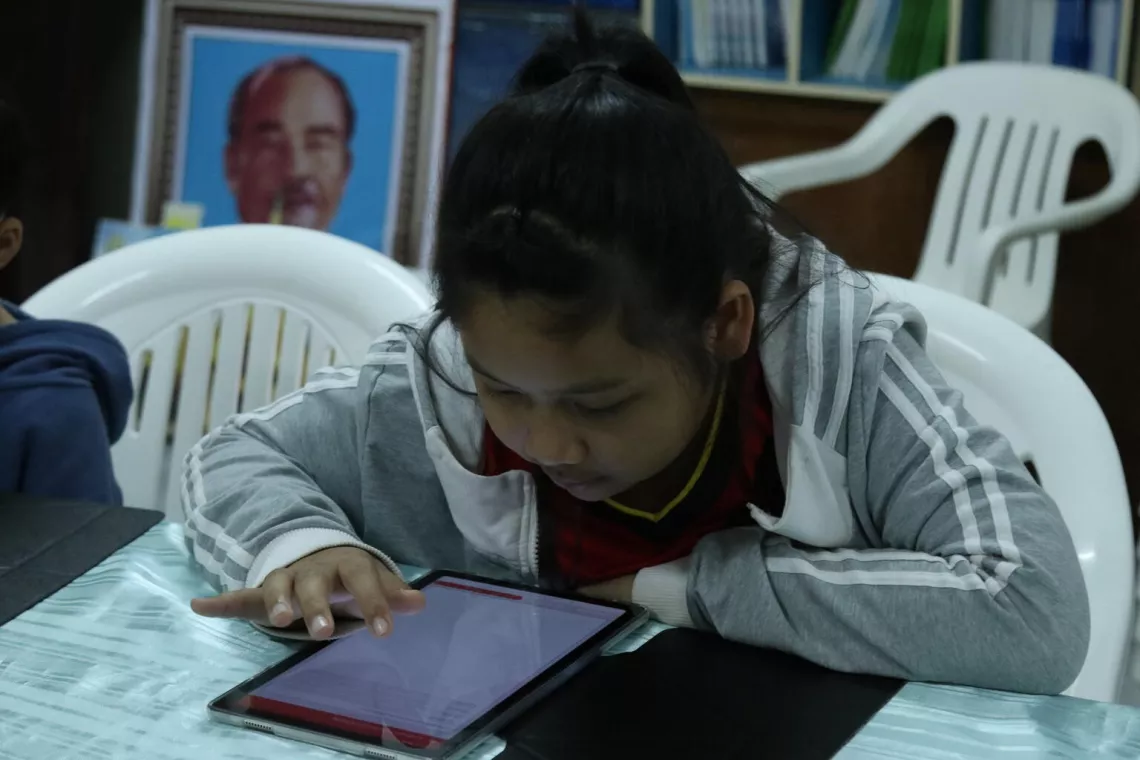 A child uses the Khang Panya Lao (teaching and learning plaform) launched by UNICEF in Lao PDR.