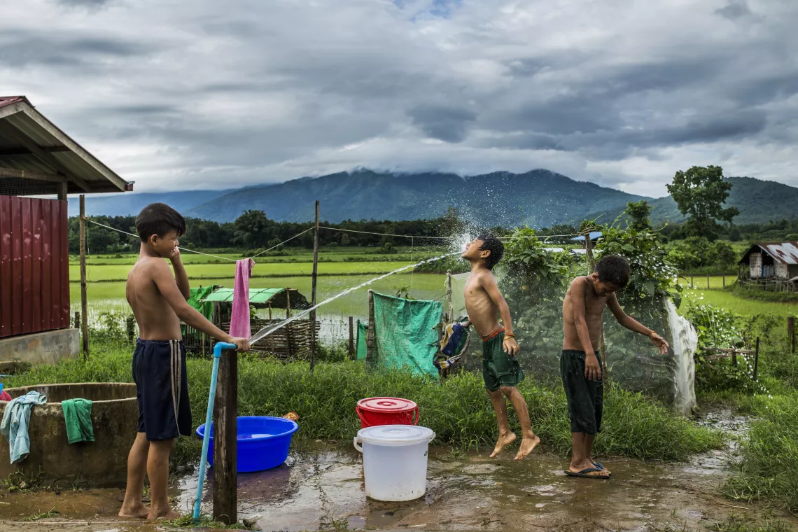Afternoon bathtime for ethnic Kachin refugee children at Pa La Na IDP camp on the outskirts of Myitkyina, Kachin, Myanmar