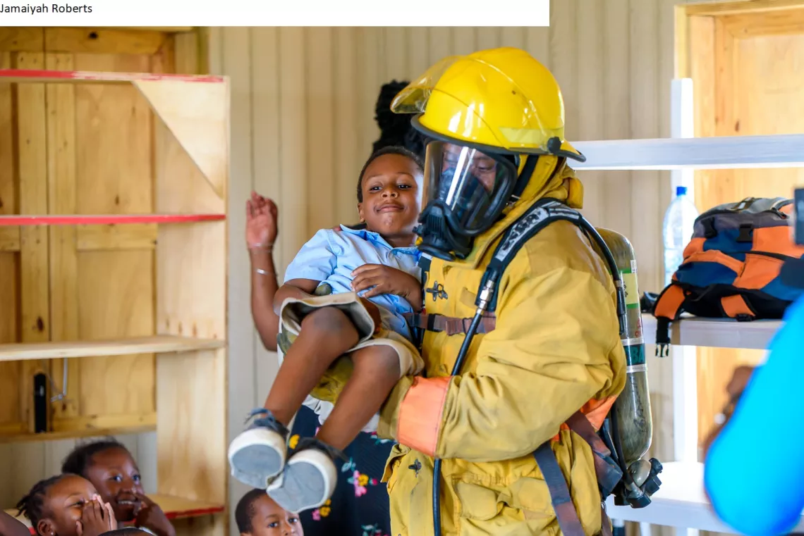 Fireman-holding-girl