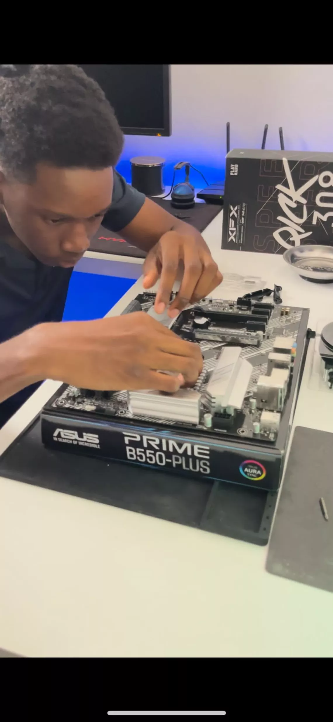 Micaiah hard at work on one of his high-end computer systems