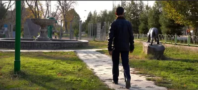 R.R. 17, walks through a park in Dushanbe, Tajikistan. With little support from his community, and facing the challenges of stigma after being released from a detention facility, R.R. is now taking part in a support programme run by UNICEF that provides him with the guidance, education and psychosocial support he needs to rebuild his life and reintegrate into society. November 2022.