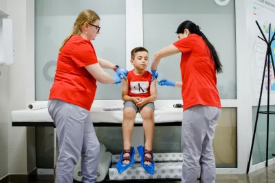 Six-year-old Mykhailyk during his vaccination medical examination, conducted by the nurses at the clinic.