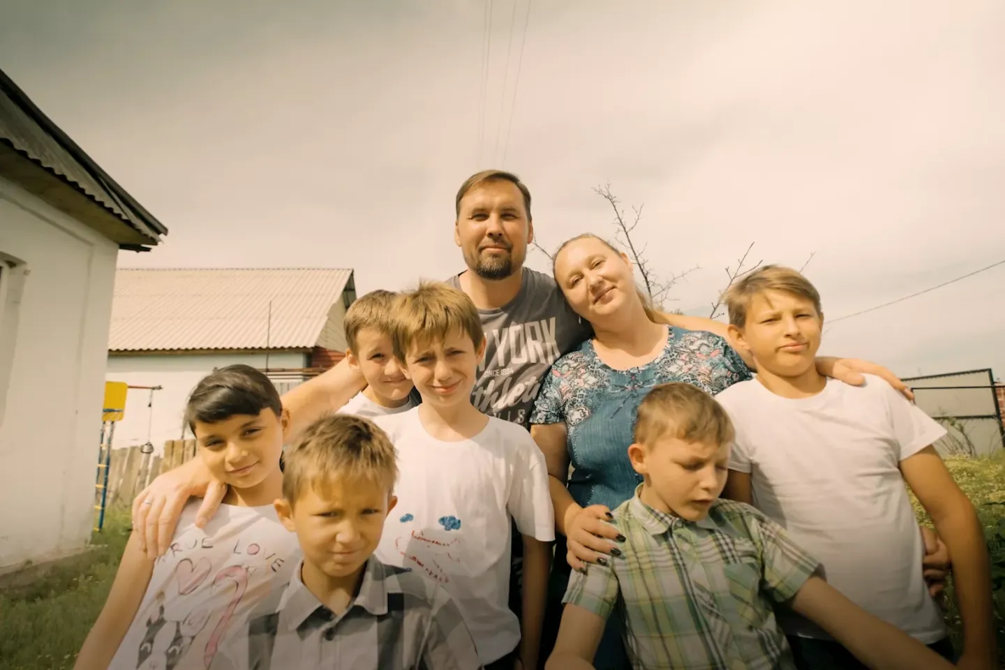 A Kazakh family together outside