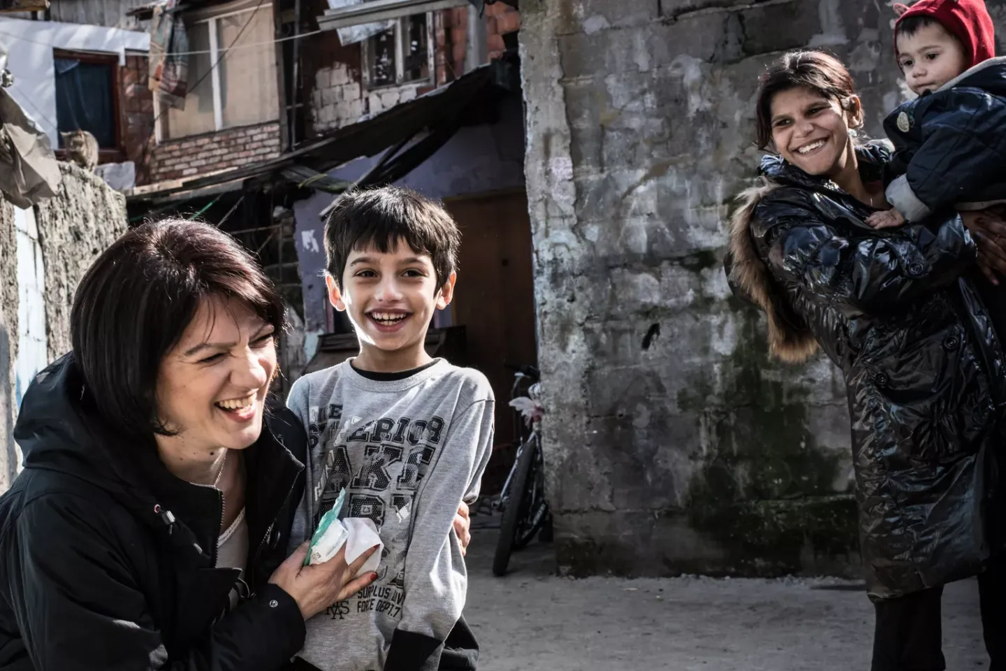 A visiting nurse, checks up on children at a 'non-hygienic settlement' on Patrijarha Dimitrija street in Belgrade, Serbia.