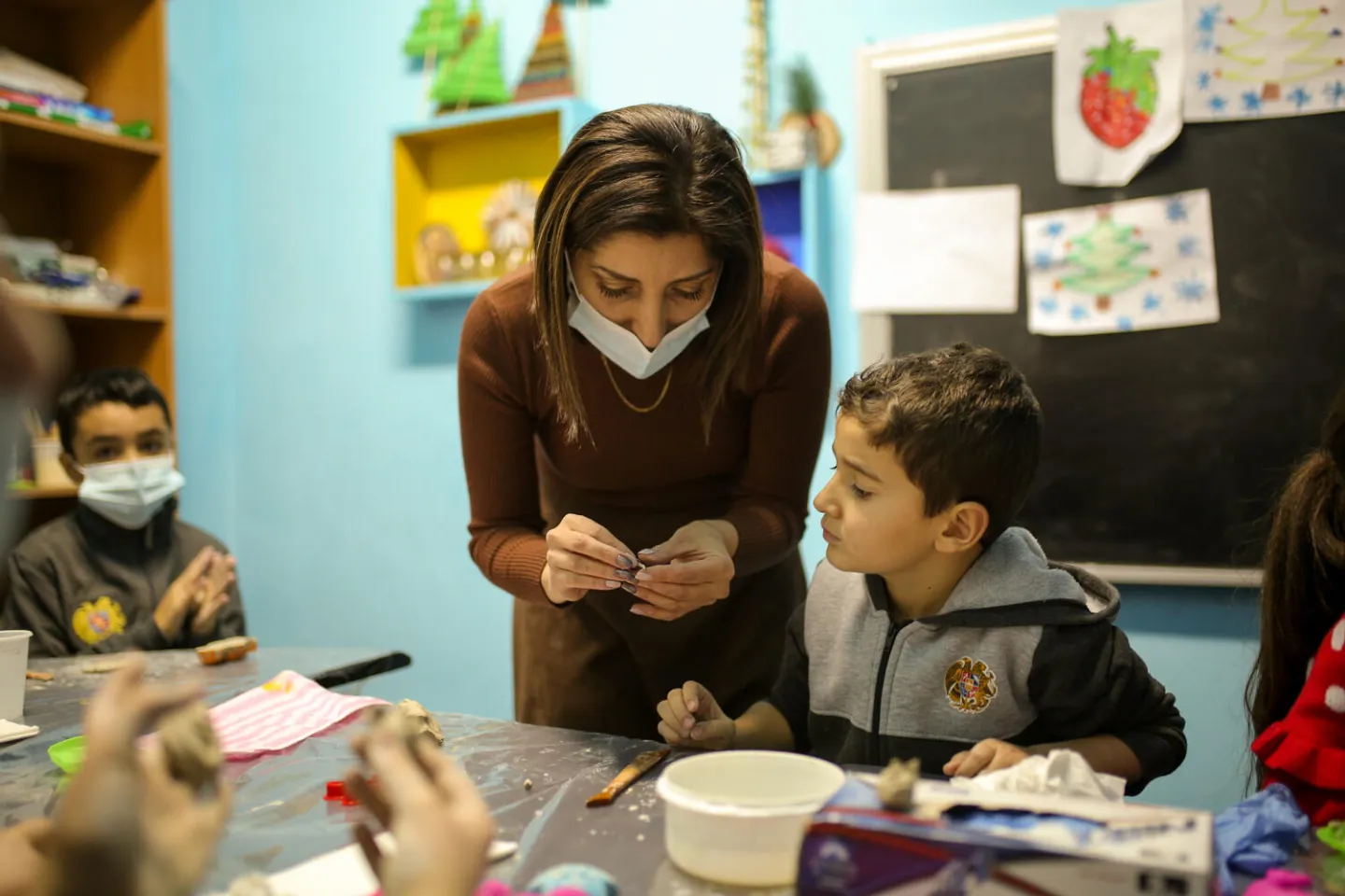 Teacher works with her student.