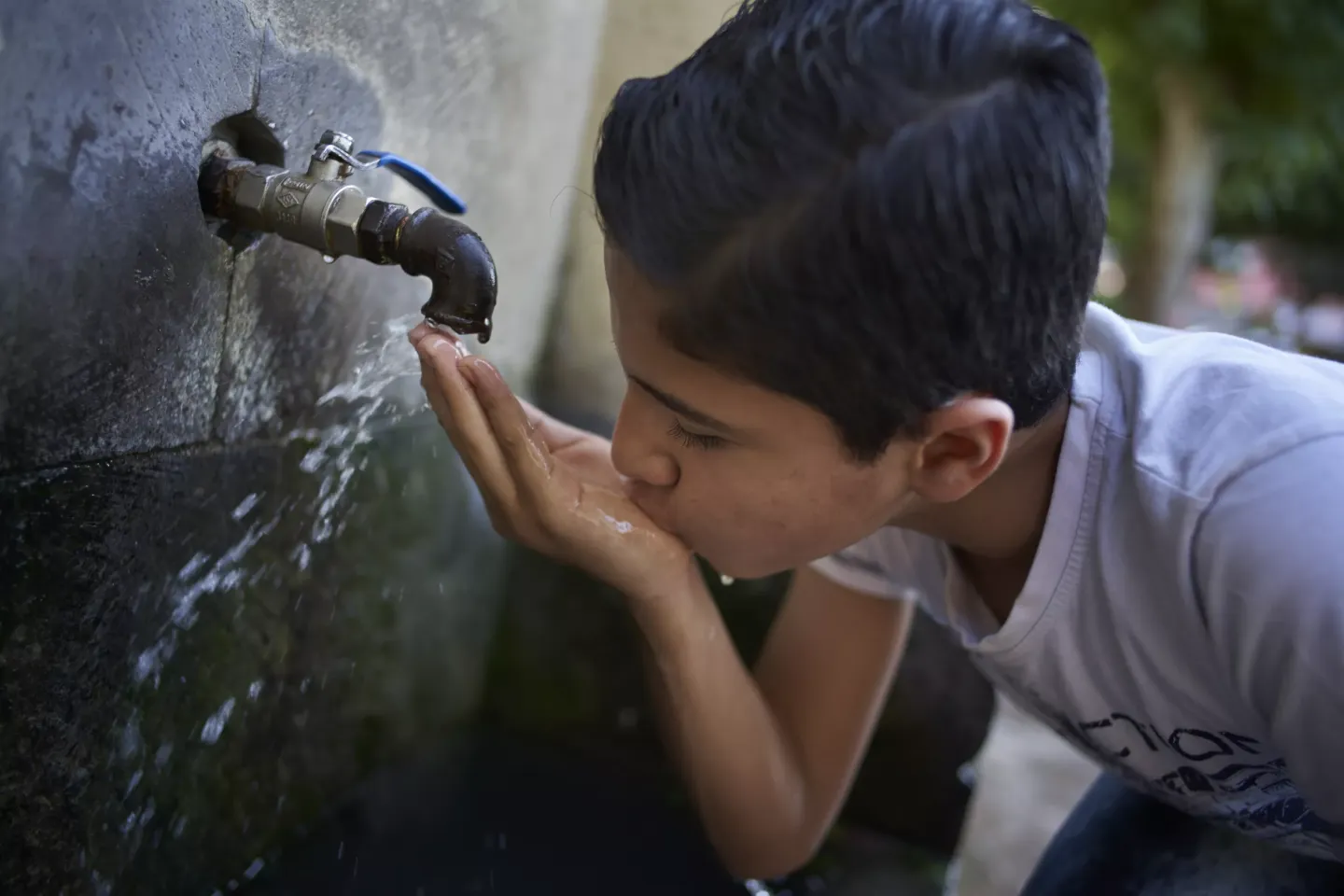 A boy drinks water