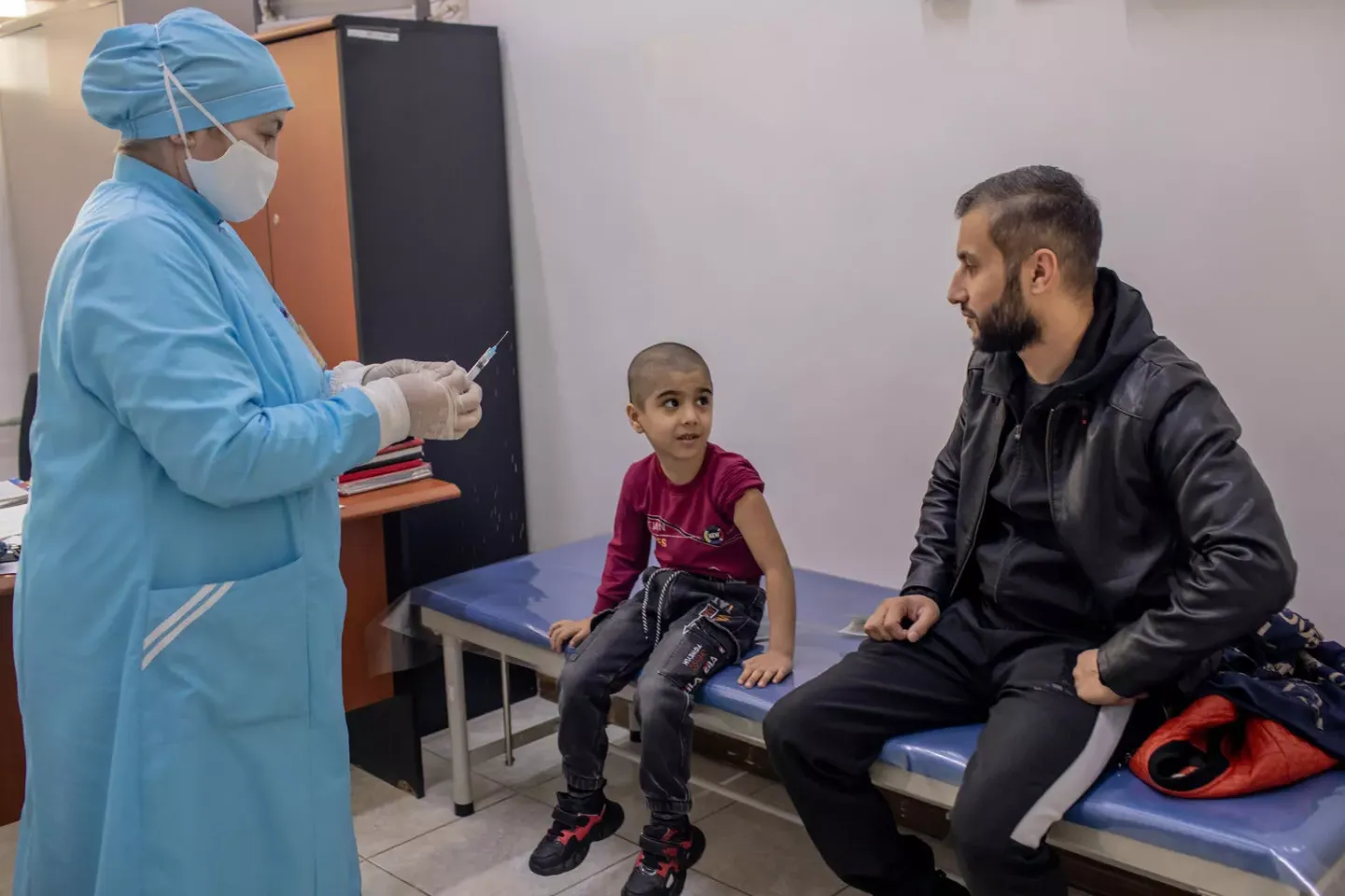 A boy receives a vaccine.