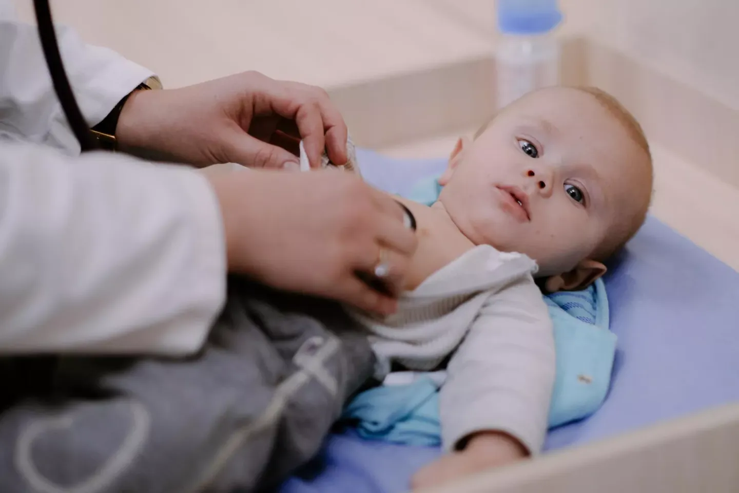 On 24 October 2022 in Pokotylivka, Kharkivska Region, Ukraine, Doctor Kateryna Kushiova, 27, examines 4-month-old Artem, before his vaccination at Primary Medical Care Centre No. 1.  He is vaccinated against pertussis, diphtheria, tetanus, polio, hepatitis B and haemophilus infection.