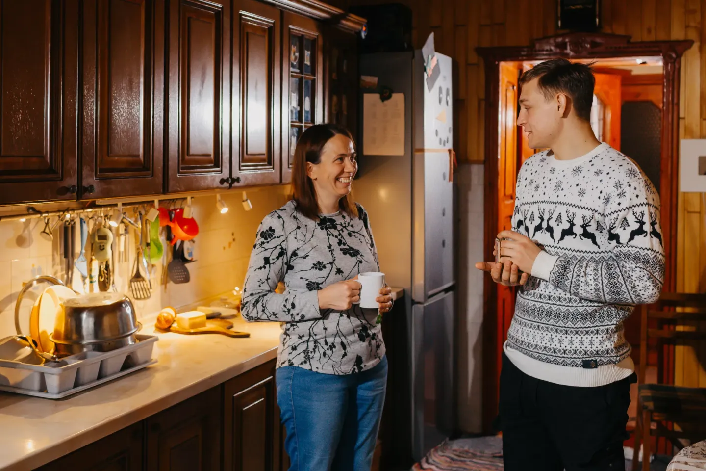 Alexandru and his foster mother, Doina, drink tea together and discuss his future plans.  