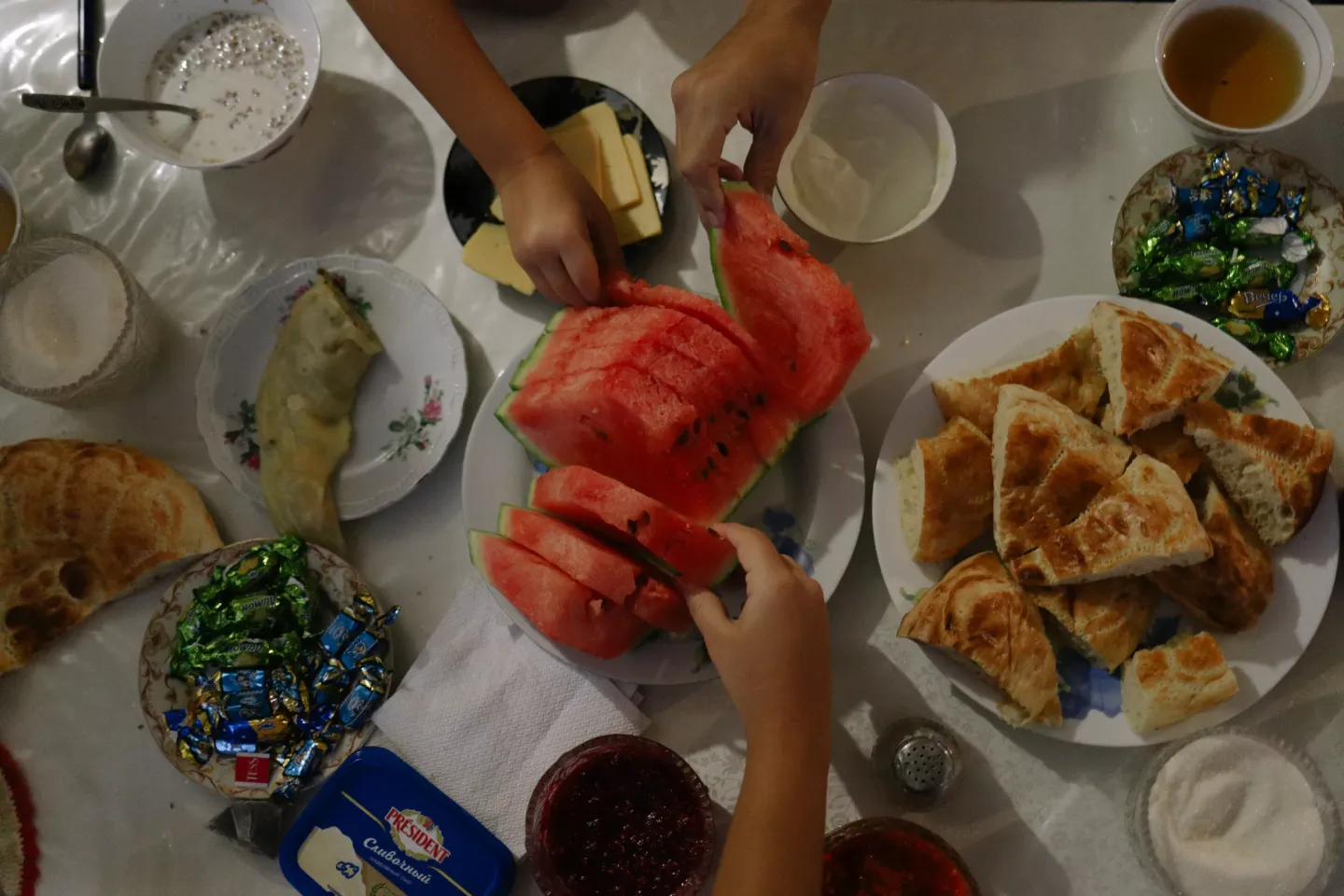 Baurzhan eats breakfast with his family in Shymkent, Kazakhstan.