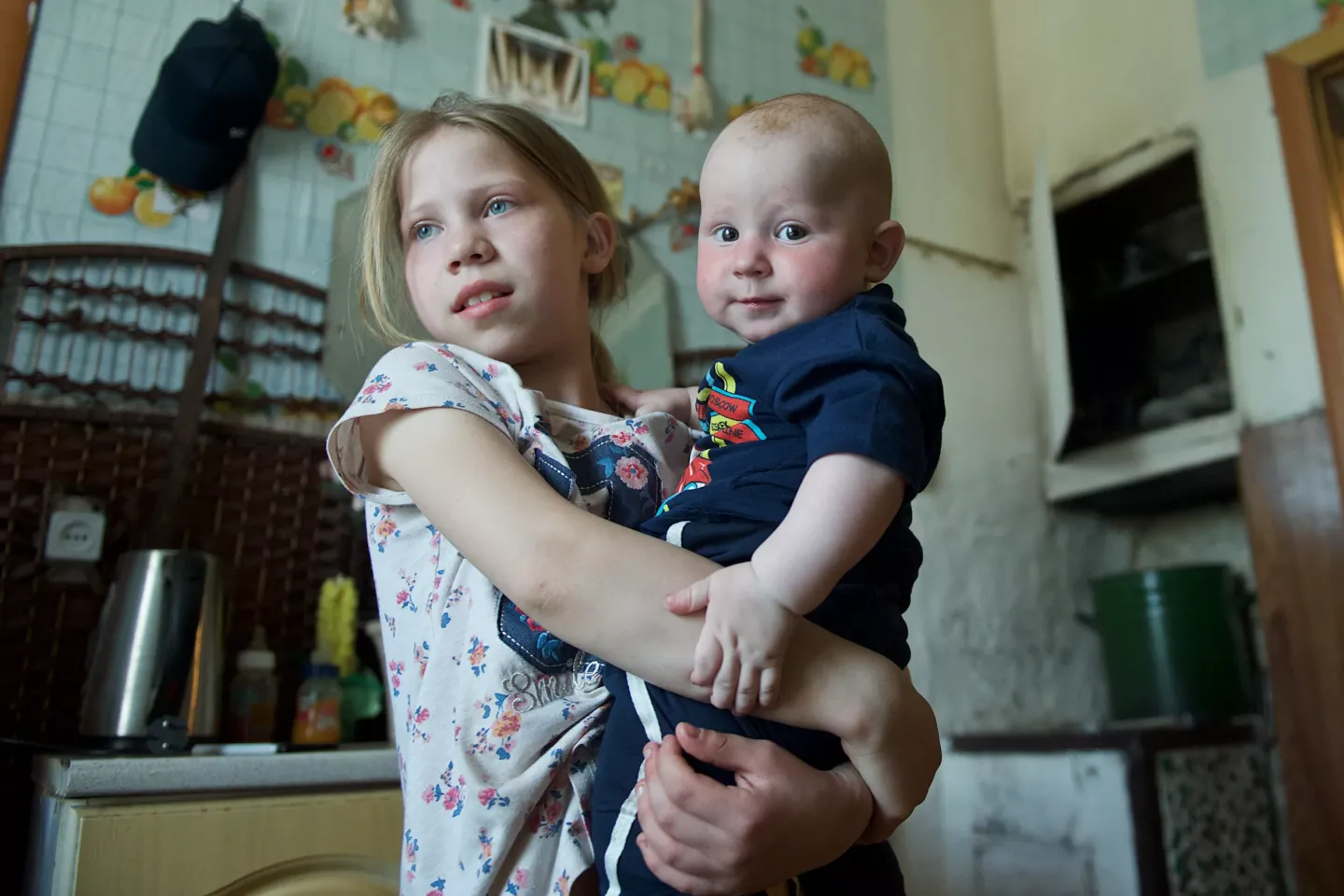 Lyubov, aged 10, holds her brother Daniil, 7 months, at their home in Astana, Kazakhstan. In 2019, UNICEF and the Ministry of Labour  and&nbsp;Social Protection launched a &lsquo;cash plus&rsquo; service to reduce child poverty and reach more children like Lyubov and Daniil. August 2019.