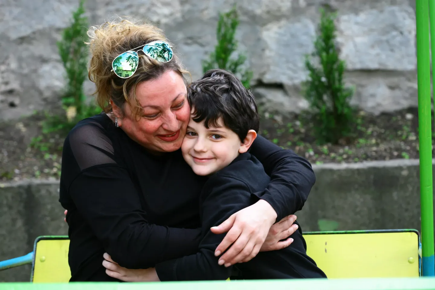 On 12 January 2024. Petya Panosyan, Vladi's foster mother (13), hugs him at their home in Shumen, Bulgaria. Today, 13 years after Petya became Vladi's foster mother, she continues to care for him and he is adopted and they both share how much they love each other and how Vladi's love and care have been life-saving from the confinement of the institution. 