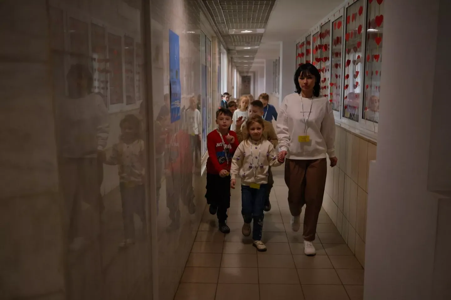 Children, that study in the subway school, are heading to their classroom.