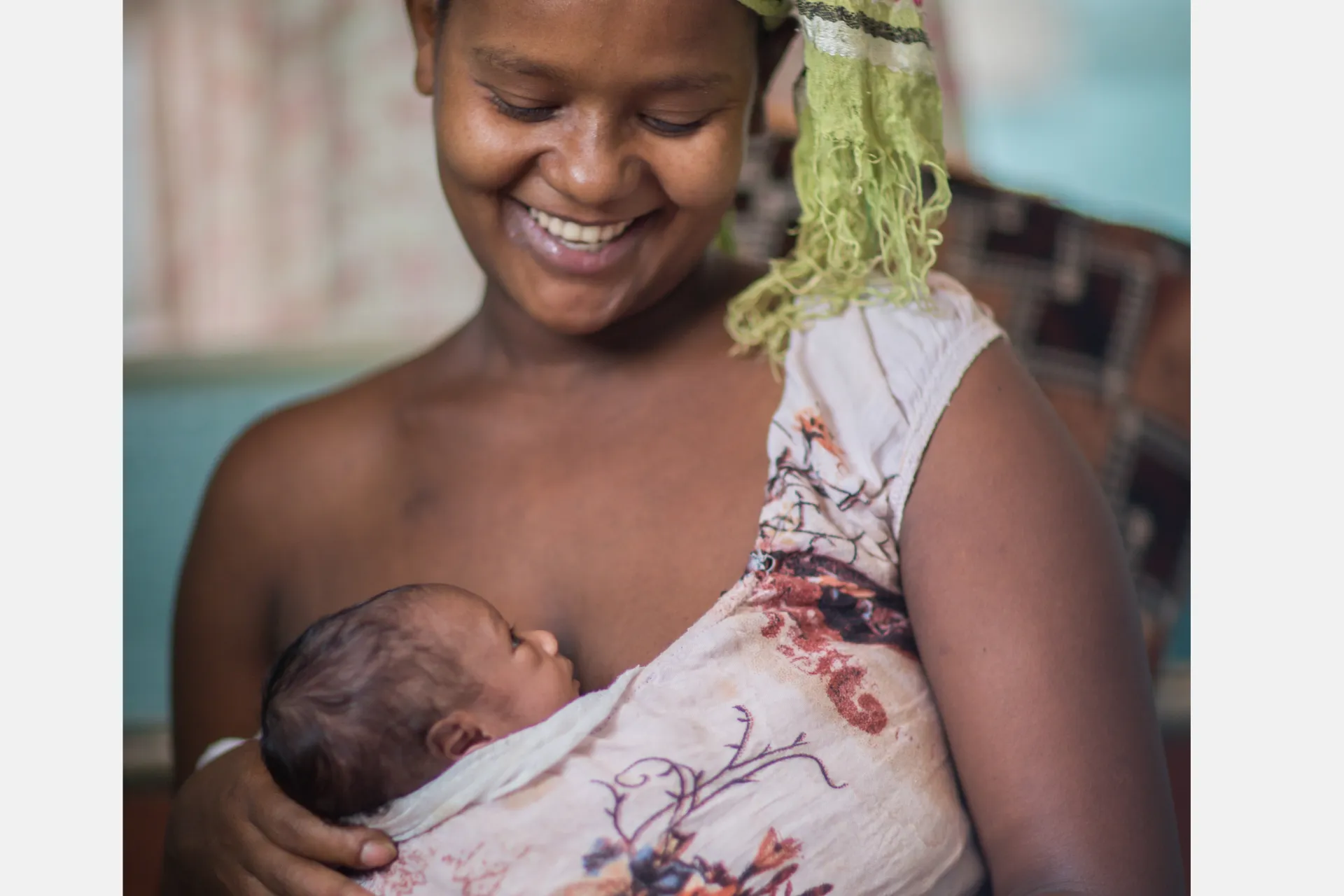 Bikile Aljra, 20, breastfeeds while giving 'kangaroo mother care', a method of care for pre-term infants, to her daughter Leti, at a UNICEF-supported Neonatal Intensive Care Unit in the remote Benishangul-Gumuz region of Ethiopia.