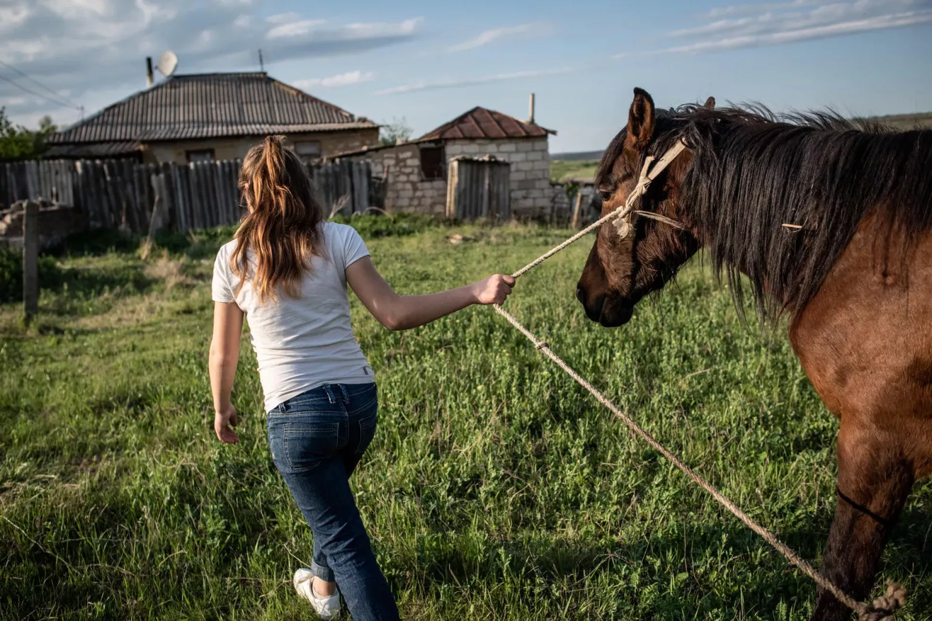Twelve-year-old Liza walks her family&rsquo;s horse to her house in her village in Moldova. After being sexually abused by her stepfather,  Liza was helped by a UNICEF-supported shelter in Chisinau, where she received medical, social and psychological support. April 2018