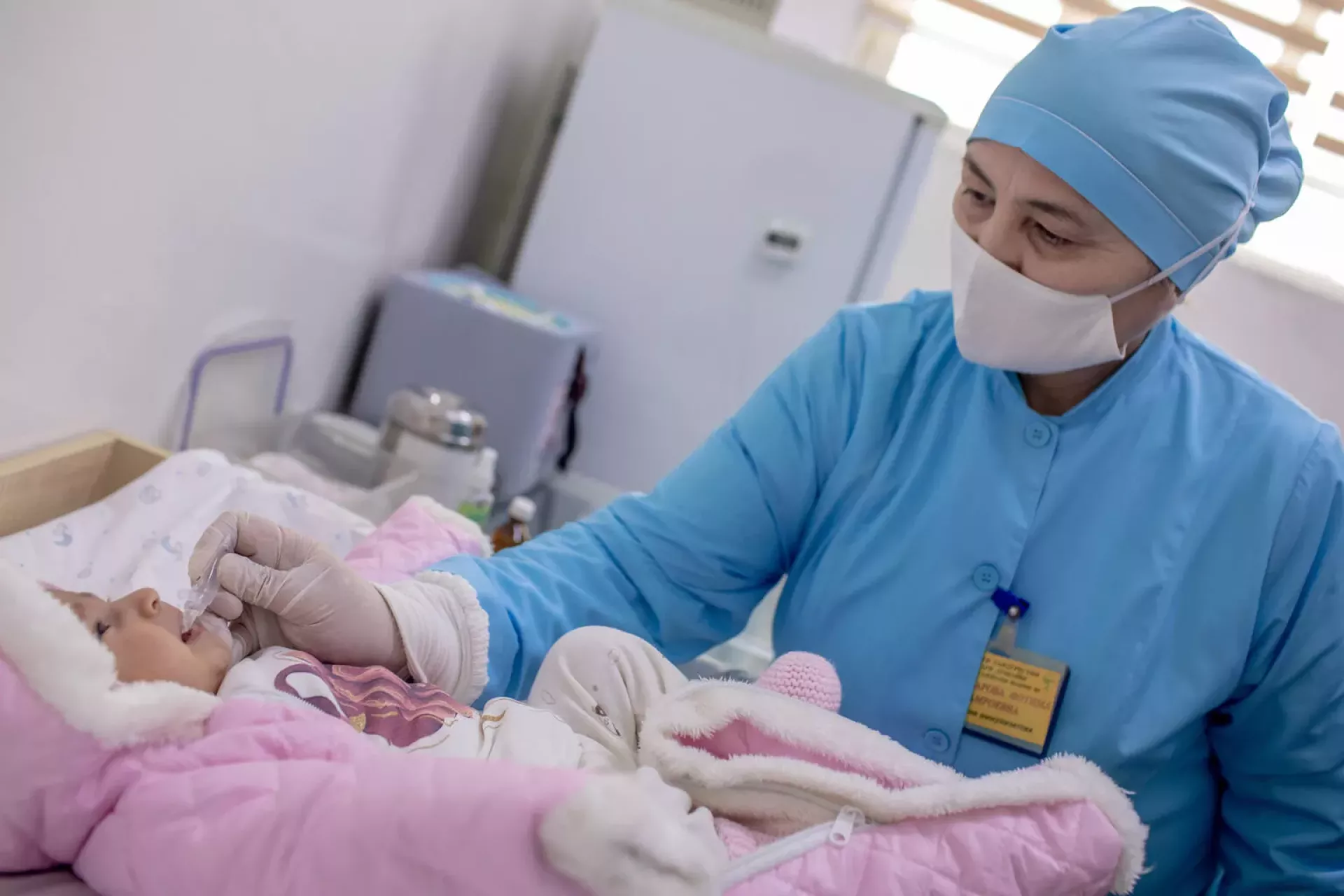 A baby receives a vaccine.