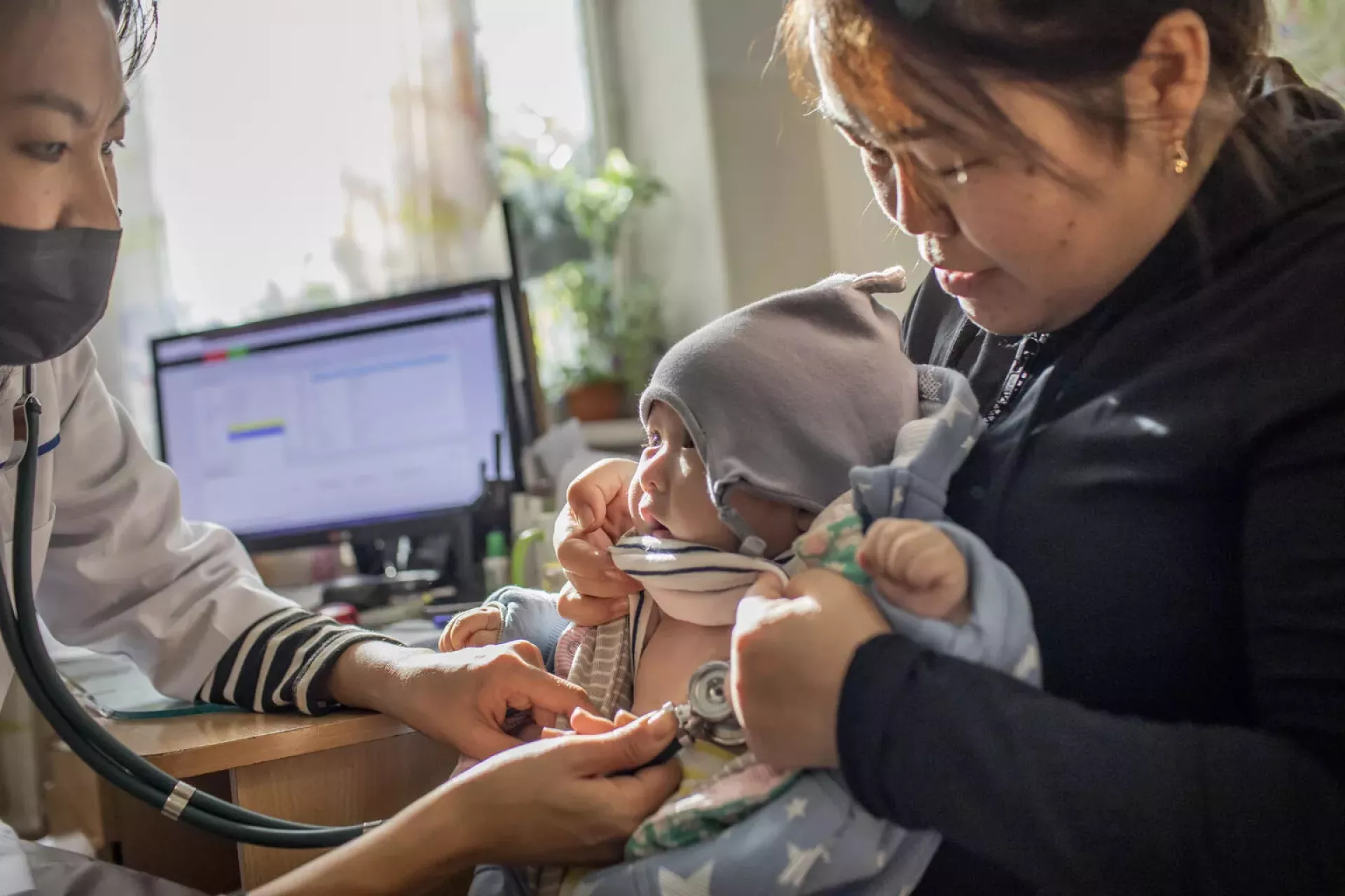 A baby receives a vaccine.