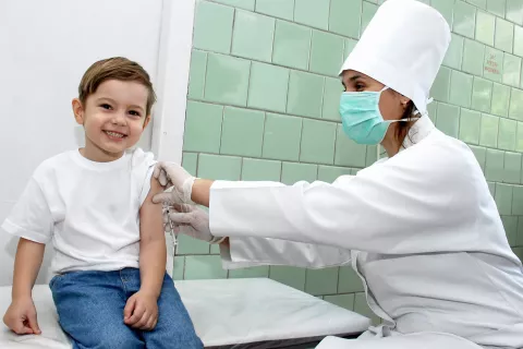 A boy receives a vaccine.
