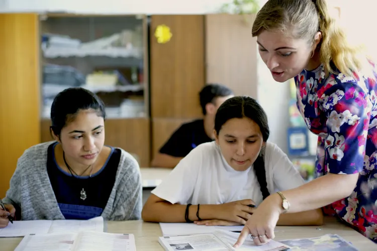 Renata and her friend Sofia, both 14, in Romanian language class.