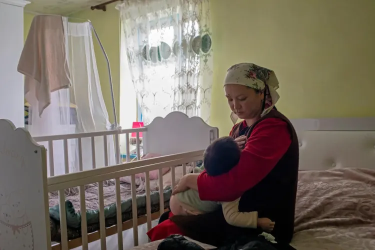 In Jayyl district, Kyrgyzstan, mother Meerim, 29, breastfeeds her 17-month-old.