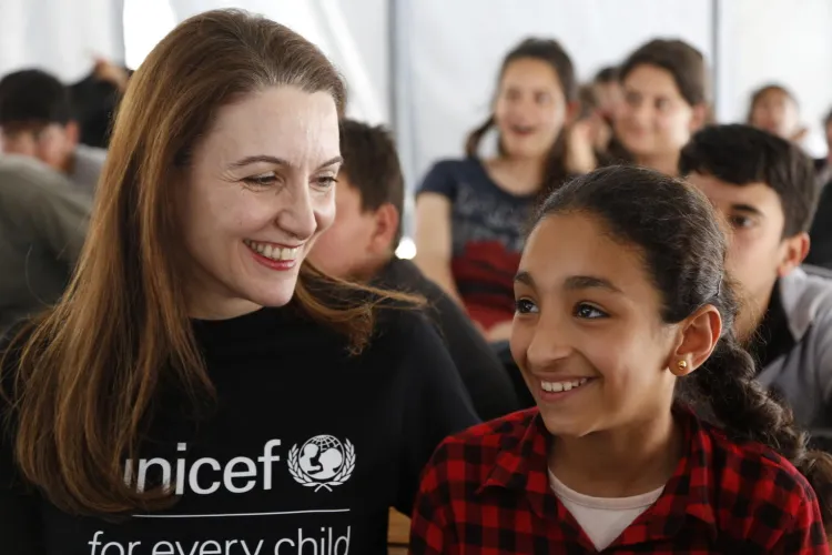 Regional Director Regina De Dominicis together with children.