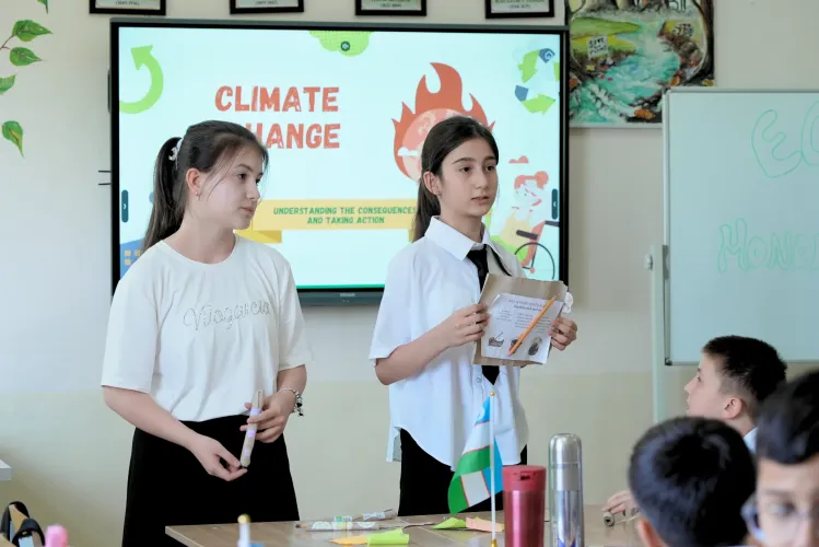 Gulnara leads a lesson on climate and the environment with her students.