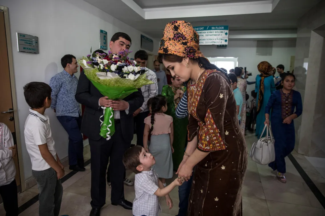 A new father, Eziz, gets ready to start the 'bring the baby home' ritual. 