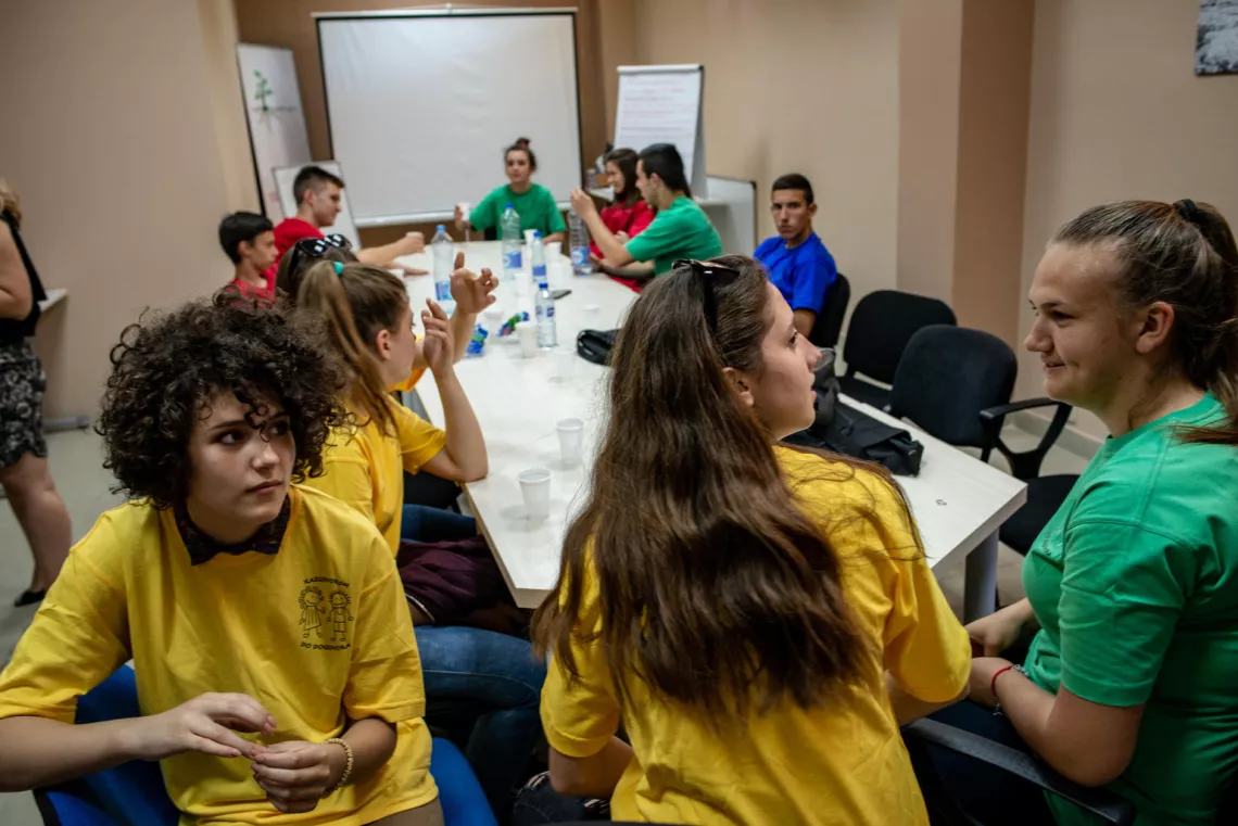 Snezana (on the left, in a yellow shirt) and her fellow peer mediators meet at the Peer Mediation Center of Domovik NGO, in Mitrovica North Kosovo (SCR 1244). UNICEF estimates approximately half of all students aged 13 to 15 globally – 150 million girls and boys – experience peer-violence. The peer mediators are student volunteers who are trained to resolve conflict at school – often cases of bullying and psychological abuse.