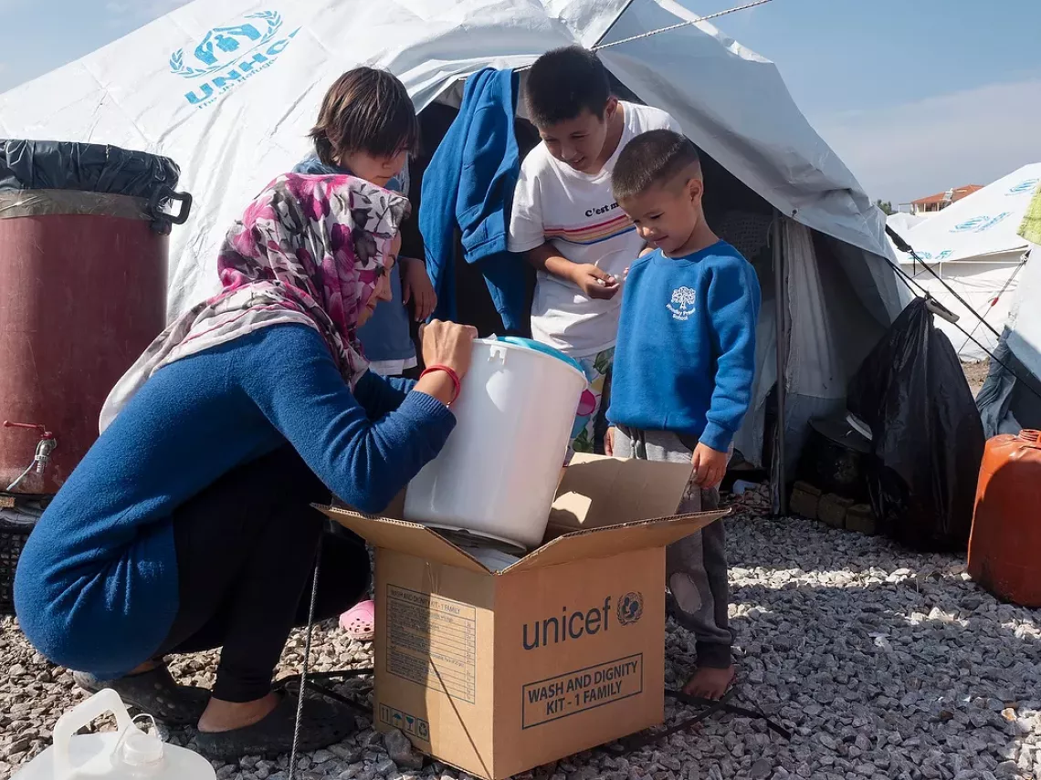 Families at a Reception and Identification Centre (Kara Tepe) on Lesvos island in Greece receive UNICEF kits containing vital supplies, including soap, a water container, a child&rsquo;s potty, multipurpose cloths, sanitary pads, clean underwear, laundry detergent and more. October 2020.