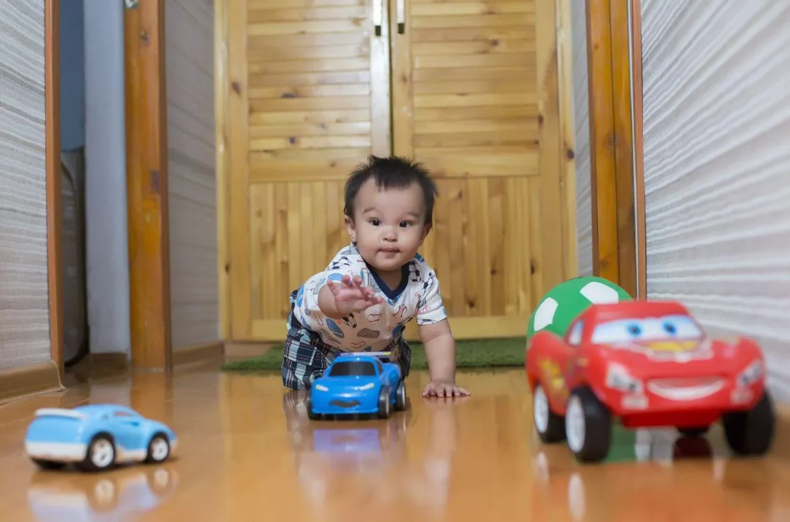 Sardor, 12 months old from Dushanbe, Tajikistan, explores colors and textures in his surroundings while playing. 