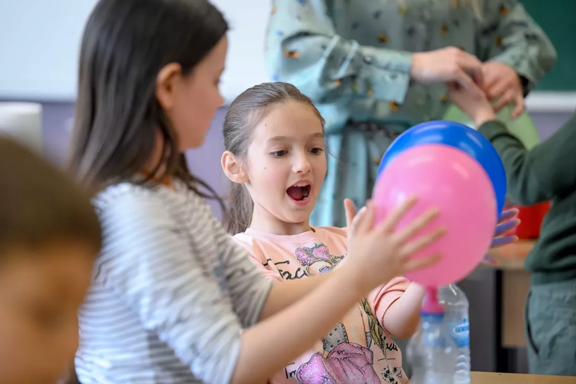 Fourth-grade children in Skopje, Macedonia do an experiment to learn about climate change, part of a climate education programme funded by Sweden and implemented by UNICEF Country Office North Macedonia. April 2022.