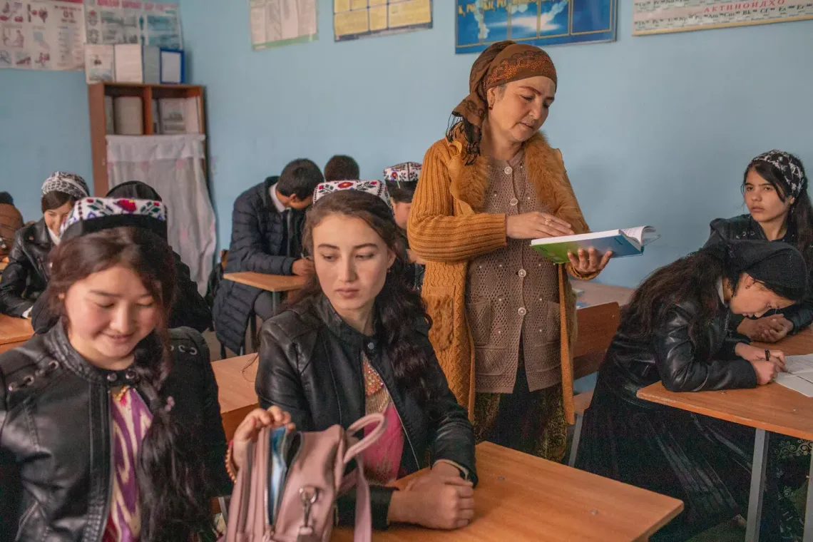 Teacher Jumagul Tashaeva guides her class through  a reading exercise at school 93, Burmai Poyon village, Tajikistan. March 2022.