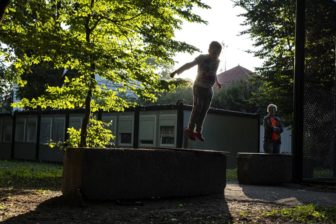 More adventurous play and risk-taking often come with being outdoors &ndash; which can help children develop resilience and confidence. Here, 7-year-old Davyd plays at a camp for displaced people in Lviv, Ukraine in August 2022. 
