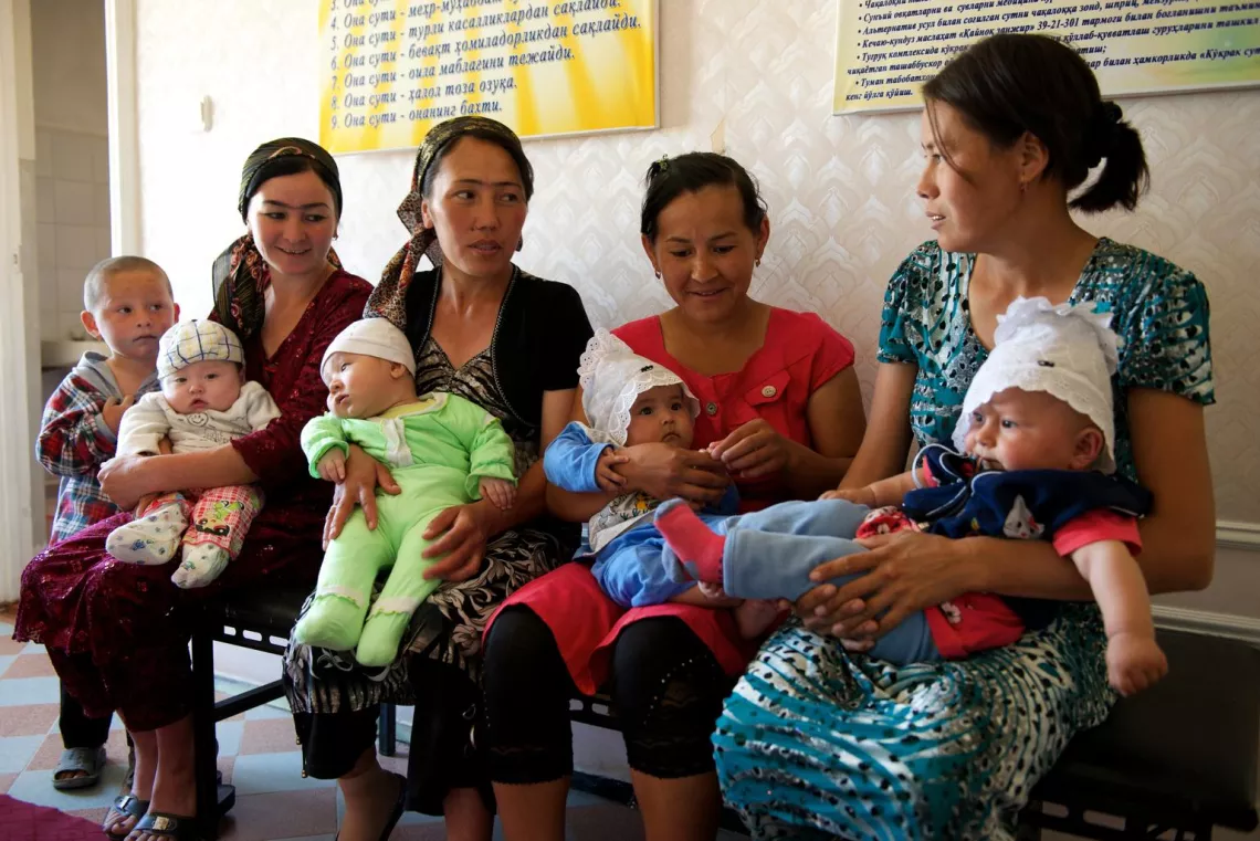 A group of women wait for their children to be vaccinated at a village clinic in Uzbekistan. 