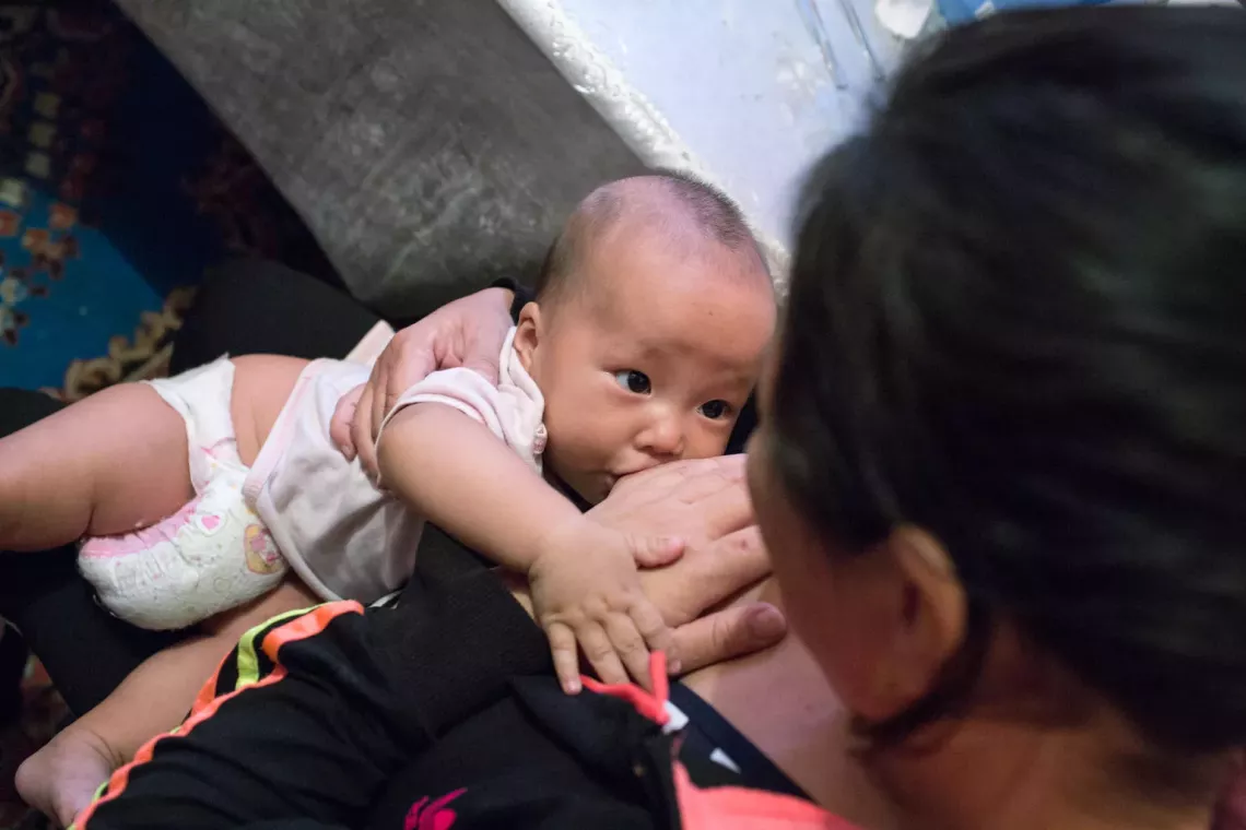 Galiya, 38, breastfeeds her daughter Alima, 5 months.  September, 2019. Almaty, Kazakhstan. 