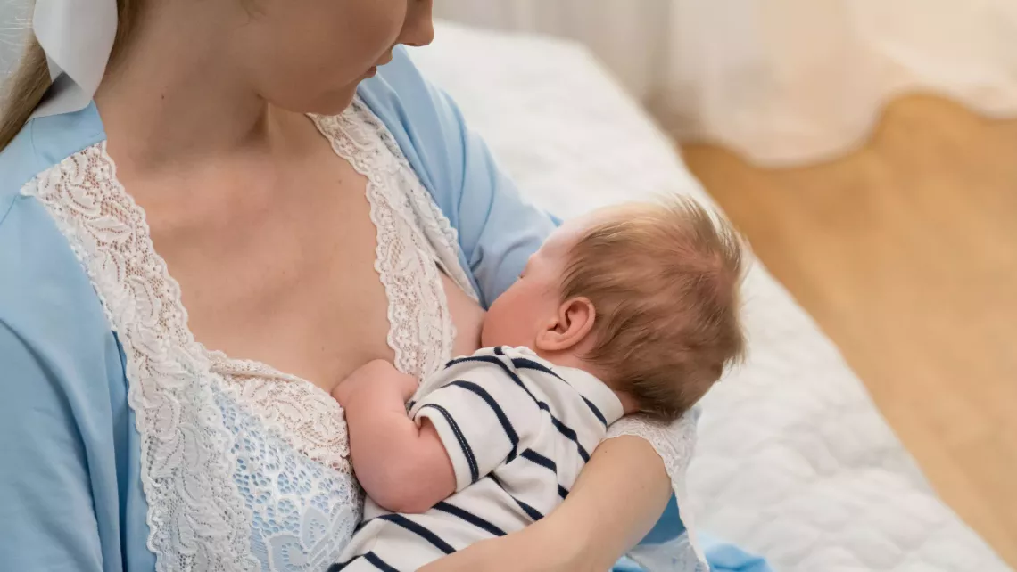 Alyona breastfeeds her 1-month-old son Svyatoslav in Kyiv, Ukraine in July 2023.