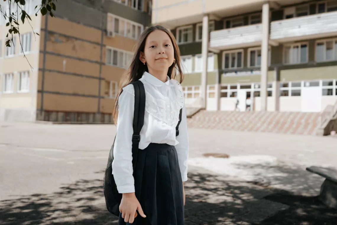 Ten-year-old Darya poses for a photo in the school's yard.