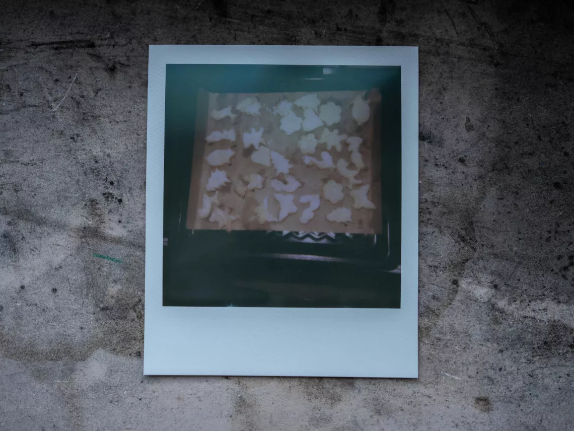 Polaroid picture from Nika's (11) photo album of memories, showing cookies, she has made with her mother.