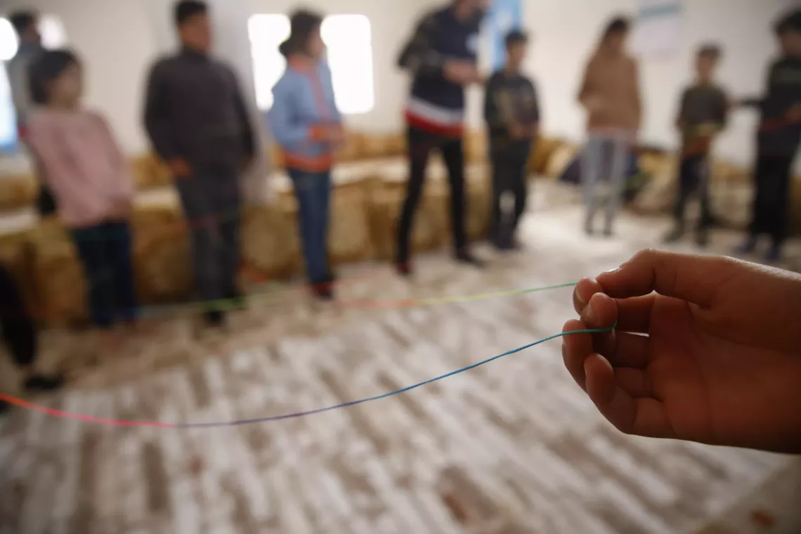 Children play with peers at a UNICEF-supported psycho-social support and gender-based violence session in Mardin, T&uuml;rkiye. February 2024.