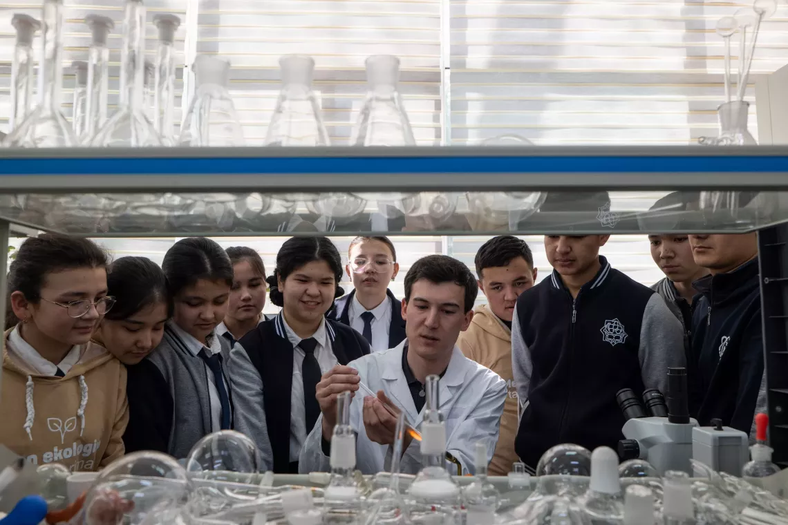 Eleventh-graders in Tashkent City, Uzbekistan learn about the effects of multiple types of gas in different conditions, March 2024.