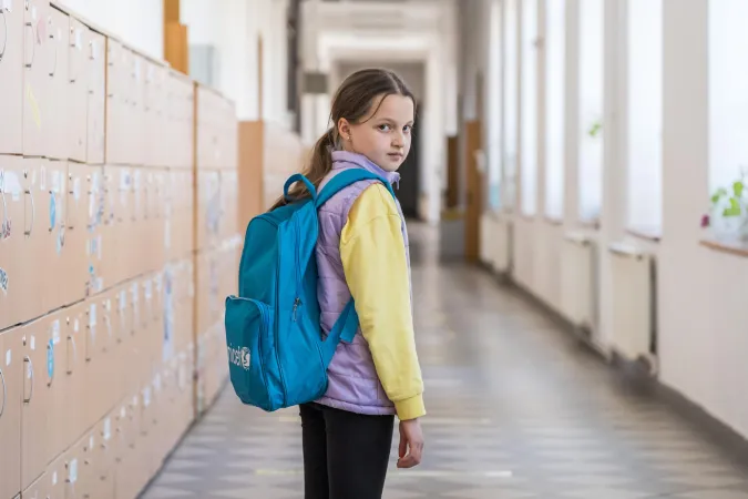 Romania. A Ukrainian child stands in the corridor of a school in Bucharest.