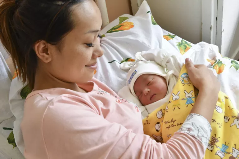Mother and her newborn baby in the Osh Maternity Hospital in Kyrgyzstan.