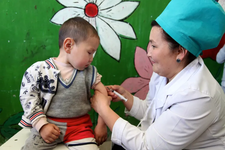 A child in Kyrgyzstan receives Measles immunisation 