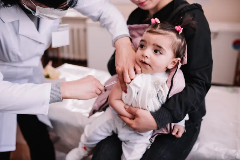 One-year-old Arina is receiving her routine vaccination. at polyclinic #1 in Vanadzor, Armenia.