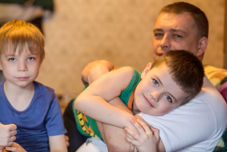 A father and his two sons at an apartment they share with his sister in Ukraine